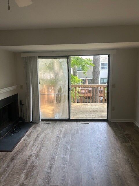 A living-room patio door with a cloudy left glass panel beside a clear panel