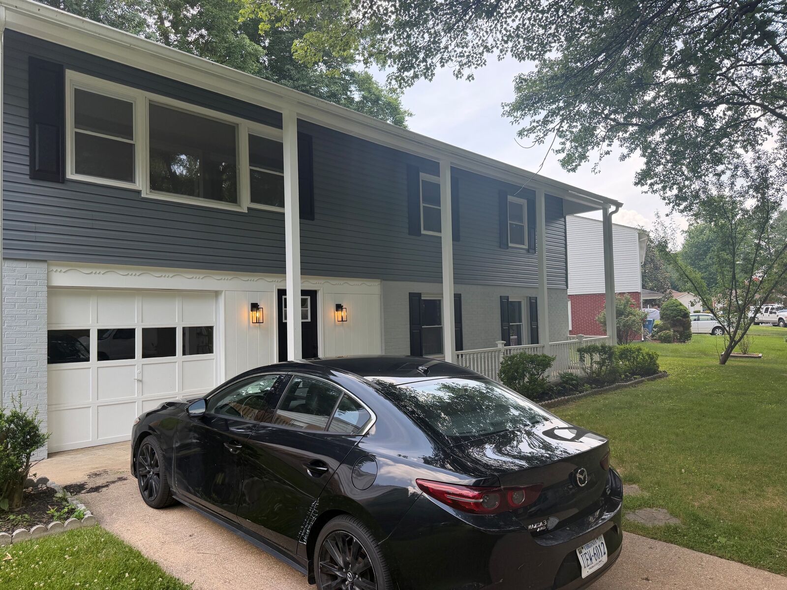 The front of a two-story house with windows and a garage